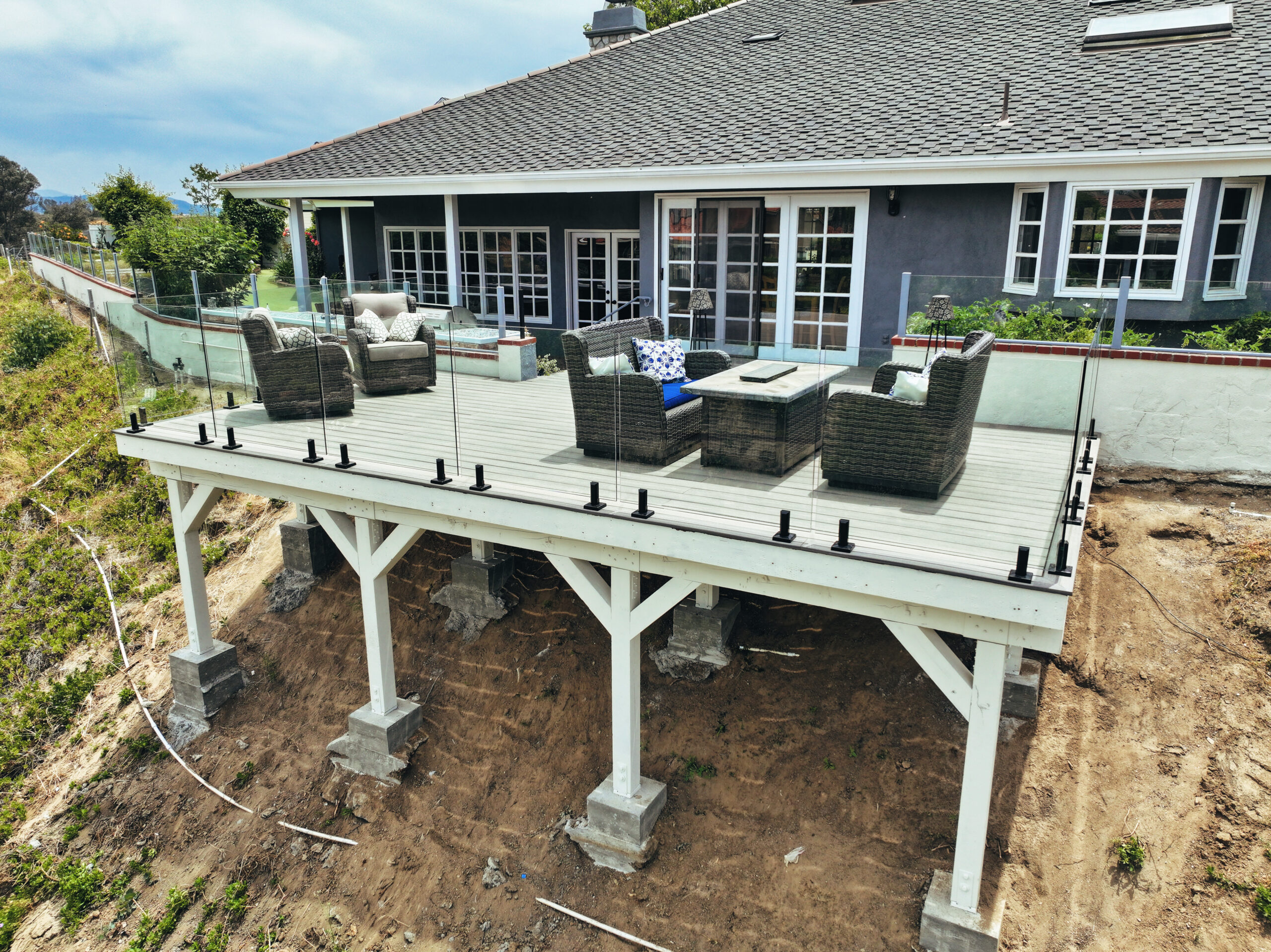 Modern covered outdoor patio and residential home addition with recessed lighting