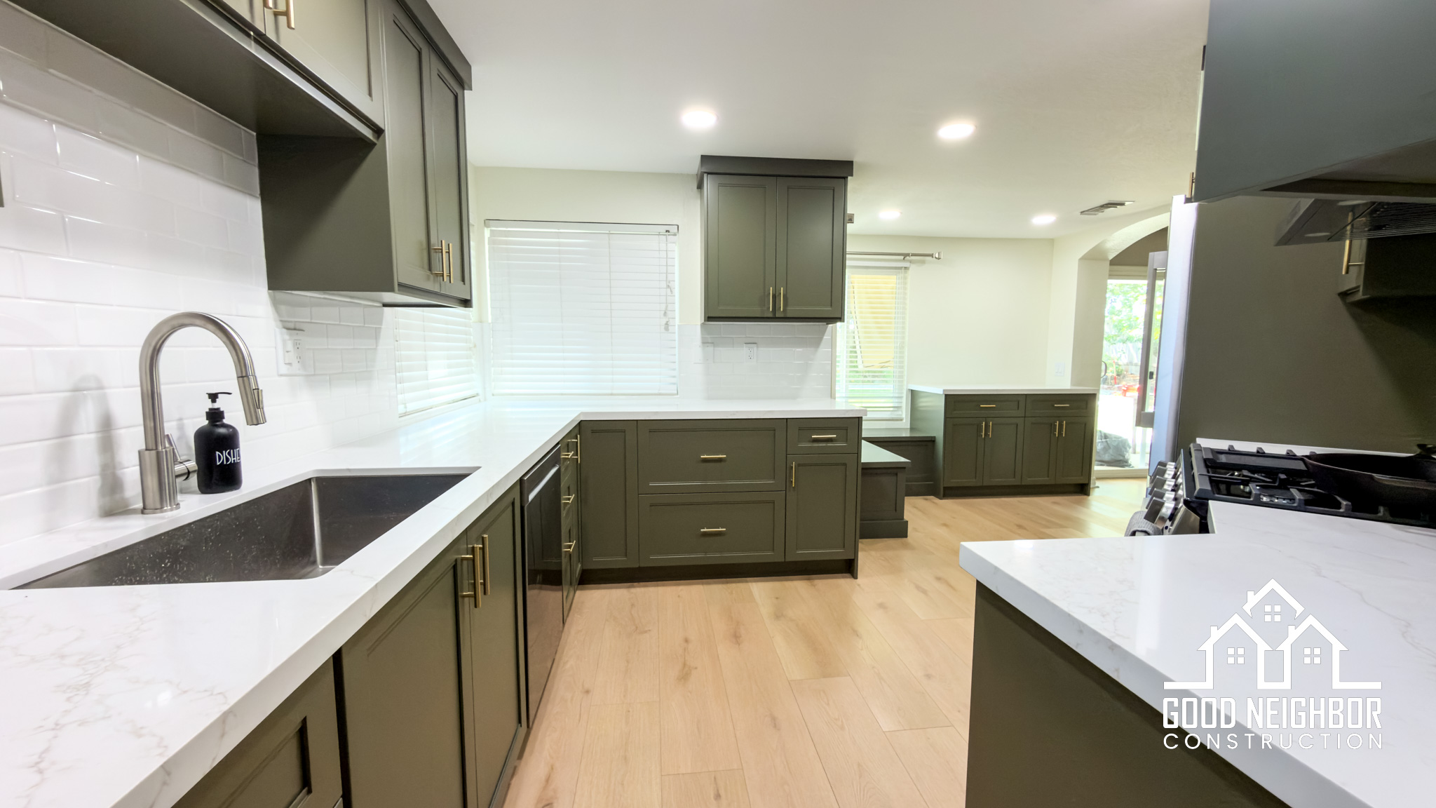 Bright open-concept kitchen remodel with custom island and pendant lighting