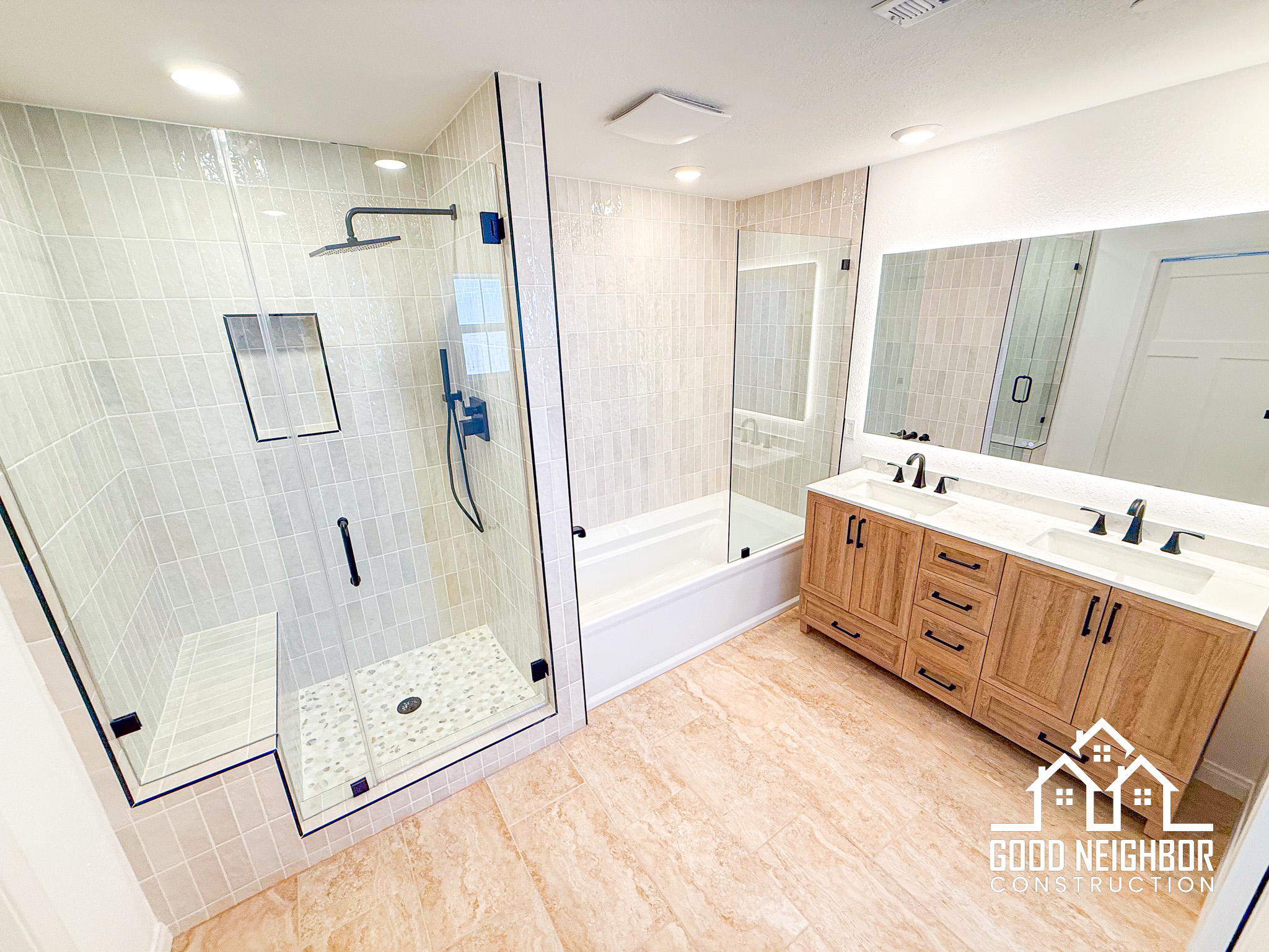 Luxury master bathroom remodel with frameless glass shower and freestanding tub
