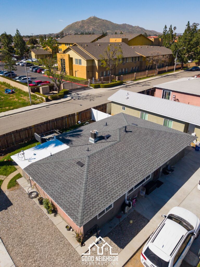 Completed roof replacement seen from the driveway