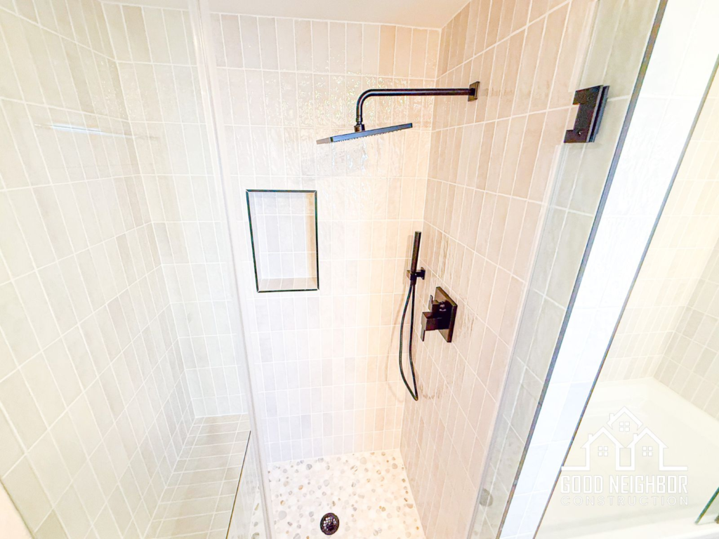 Finished walk-in shower with matte black fixtures in Redlands