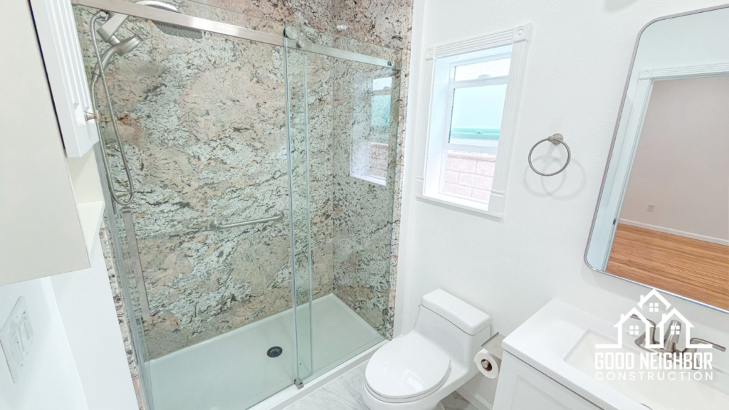 Finished ADU bathroom with tiled tub surround in Riverside
