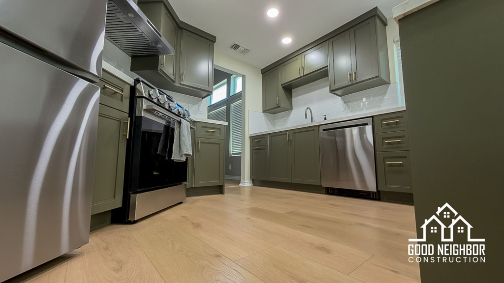 Finished kitchen remodel in Riverside with green cabinets